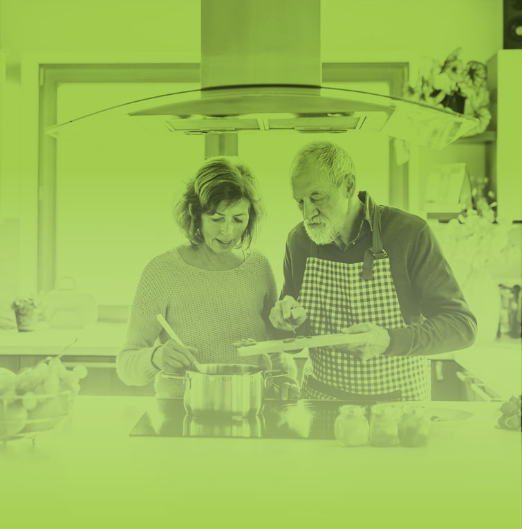 Photograph of a couple cooking together