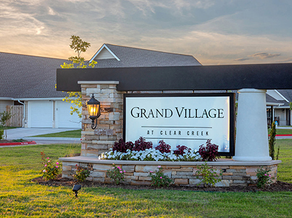 Photograph of the monument signage of Grand Village at Clear Creek
