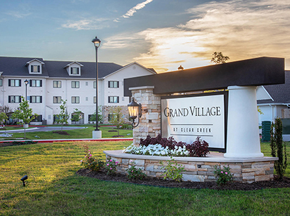 Photograph of the monument signage of Grand Village at Clear Creek